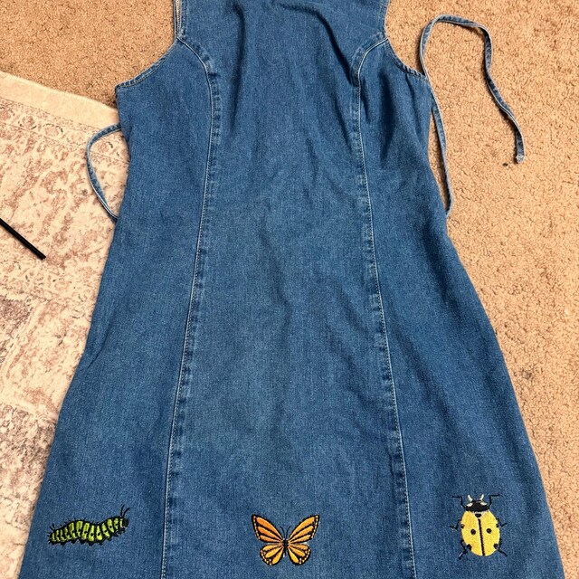 Customer’s denim dress with caterpillar, butterfly, and ladybug embroidery